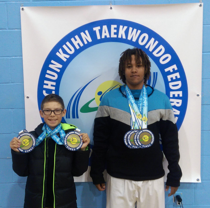 N. D. Hanson (right) displays his four gold medals from the Founder's Classic Open Championships in Roseland, New Jersey on Saturday, December 3, 2016.